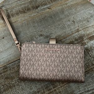 Michael Kors rose gold double zip wallet. NEVER used. just doesn’t have tags.